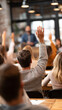 © Atchariya63 - Classroom workshop training seminar audience learning education raised hand question discussion lecture student adult group teamwork participation