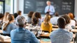 © soem - A diverse group of students attentively listening to a teacher in a classroom setting.