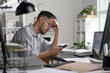 © amenic181 - Businessman looking stressed while using phone, Businessman working at office feels overworked and burnout