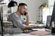 © amenic181 - Stressed businessman talking on the phone, Businessman working at office feels overworked and burnout