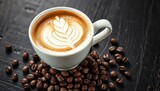 A pristine white cup filled with a creamy, latte art-adorned lungo sits on a rustic black table, surrounded by scattered coffee beans,  warm,  hot drink