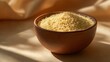 © fivan - A couscous bowl with cream ceramic tones, isolated on beige surface
