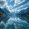 © StepRunnerIO - Crystal alpine lake with snow capped peaks and dramatic clouds reflected in still water, pristine scenery
