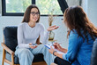 © Valerii Honcharuk - Young smiling girl patient in therapy session with social mental therapist