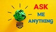© Muji Creatives - Crumpled green paper light bulb with “Ask me Anything” text on bright yellow background.