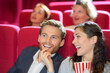 © auremar - happy couple watching movie in cinema