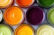 © chusnul - Colorful assortment of vibrant smoothies in glass jars arranged neatly, showcasing a healthy lifestyle choice
