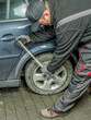 © Roman Milert - Auto mechanic changing rear tire in passenger car
