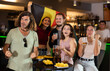© JackF - Happy girls adm men with Belgian flag celebrates the victory of her favorite team in a beer bar