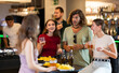 © JackF - Happy mens and womens drinking beer and eating crisps, laughing and spending time together in a bar
