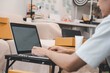 © pornnipa - Startup small business owner packing boxes for online customer delivery. Entrepreneur managing e-commerce orders, shipping parcels, and running home-based business operations from home office.