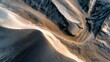 © ArtPixel-Portfolio - Desert landscape aerial view showing sand dunes and eroded mountains creating abstract patterns in arid environment