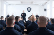 © Andrii - Newly Recruited Police Cadets in Dark Uniforms Attending a Formal Training Session at the Police Academy. Excellent for editorial use covering law enforcement careers, police training programs