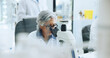 © SiphosethuFan/peopleimages.com - Microscope, medical research and woman in lab, genetics test and pharmaceutical study. Mature person, innovation and scientist with equipment, microbiology or vaccine development with bacteria