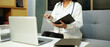 © Stella 16 - female woman doctor therapist working in office reading data