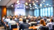 © Joseph - Corporate Seminar Blur: A blurred background of a corporate seminar or training session in a conference hall, with attendees. People in professional meeting of business leadership strategy in event