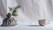 © Line - Eco gift bag and ceramic mug on soft white fabric background