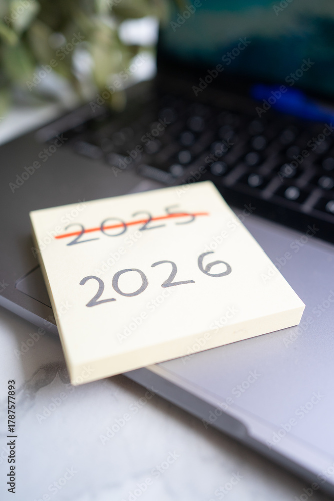 Sticky note showing 2025 crossed out with 2026 Stock Photo | Adobe Stock