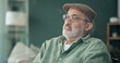© peopleimages.com - Thinking, sad and senior man in home for depression, alone and reflection in house. Retirement, disappointed and elderly person with memory, lonely and thoughtful for isolation in living room