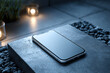 © Petr - Modern smartphone with blank screen on basalt tile under cool edge lighting