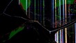 © kinomaster - Close up of a broken TV screen displaying colorful pixel distortion and crack lines from impact.