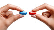 © Varunee - Pills in Hand: A close-up shot presents a pivotal choice between red and blue pills held delicately between fingers, hinting at a metaphoric decision