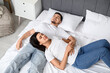 © Pixel-Shot - Loving young couple sleeping on bed at home