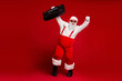 © deagreez - Energetic Santa dances with a boombox in a red suit against a solid red background full of festive energy