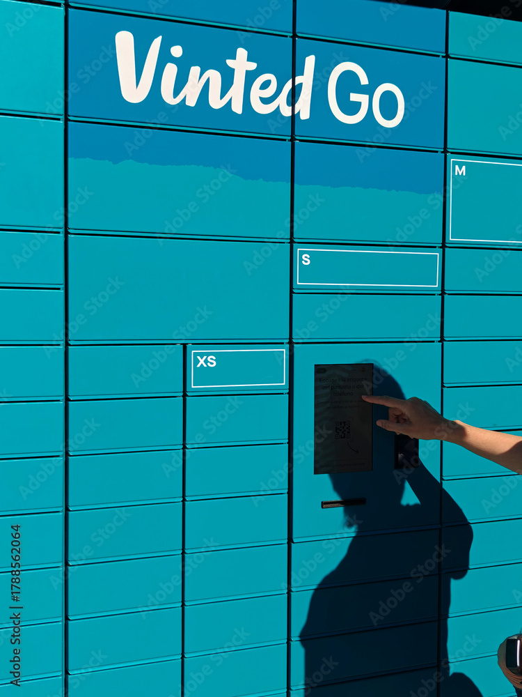 Vinted Inpost Locker Finestrat, Spain- 10 November 2025: Woman using Vinted go locker ...