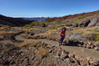 © Xalanx - Woman hiker with camera on an uphill trail towards Pico Viejo