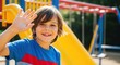 © Running opossum - joyful young boy waving at the camera at a colorful playground on a sunny day