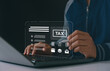 © MUNTHITA - Person using laptop and stylus with digital tax interface, illustrating online tax filing, financial management, e-document submission and modern accounting technology.