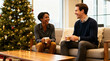 © Favio - Two smiling coworkers sitting on a cozy sofa near a decorated christmas tree enjoying coffee and conversation.