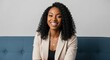 © Farhan - Portrait of a Friendly Black Female Psychologist or Therapist. Confident Professional Woman Smiling at Camera, Offering Mental Health Support.