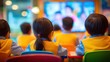 © The Little Hut - Young Students Watching Educational Video in Classroom, Rear View of Children Focused on Learning