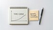 © Muiz - Time Curve Chart Representation for Business Growth and Continuity Planning on Notepad with Pen and Sticky Note