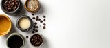 Coffee beans and cups of coffee on white background.