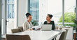 © peopleimages.com - Laptop, meeting and business women in office for planning, finance report and collaboration. Computer, paperwork and financial advisors with investment proposal, tech and discussion in workplace