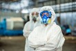 © BESTIMAGE - Male inspector team investigate danger chemical gas leak spill with safety face mask PPE suit in area closed barricade security tape. danger dirty area infected chemical leak spill cross stripe ribbon