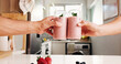 © PeakCC/peopleimages.com - Smoothie, toast or hands in kitchen with fruit drink, organic nutrition or antioxidant benefits. People, strawberry or protein shake cheers in home for digestive health, morning beverage or hydration