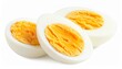 © Nidae - Three halves of hard-boiled eggs with bright yellow crumbly yolks and firm white egg whites, arranged on a white surface to highlight texture and nutritional simplicity.