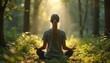 © Vadym - Young woman meditates in sunlit forest glade. Blonde female sits cross legged on ground, breathes deeply. Tranquil nature scene promotes peace and healthy lifestyle.