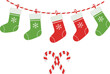 © DCreativ - Festive Christmas stockings hanging on a string with candy canes below.