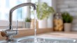 © backup_studio - Chrome faucet with running water filling a kitchen sink. Concept of clean water, plumber service, and home maintenance.
