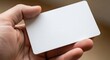 © Tonmoy - Hand holding blank white card for information or identification