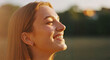 © Svetlana - Young woman smiling in sunlight with nature background
