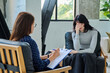 © Valerii Honcharuk - Sad stressed young woman patient talking with female psychologist, mental counselor