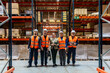 © unai - Logistics team workers standing in large distribution warehouse