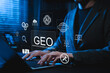 © Supatman - GEO Generative Engine Optimization Concept. Professional using laptop with AI icons represents advanced SEO tech, AI search, website strategy, answer content automation, data driven digital marketing,