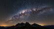 © Meheru - A view of the milky way galaxy over a mountain range with a dark sky full of stars at night time